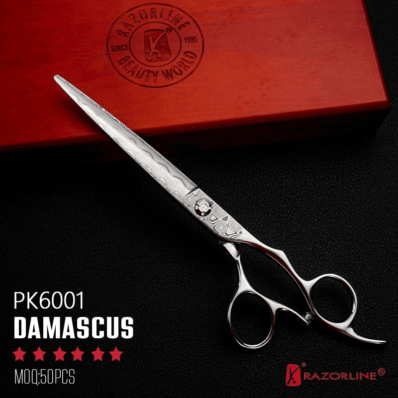 Razorline PK6001 luxury Damascus steel pet grooming shear with characteristic wavy pattern and ergonomic offset handle next to a wooden gift box.
